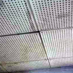 AIB ceiling tile with holes in it