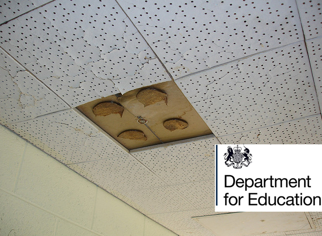 A photo of asbestos ceiling tiles with holes in them